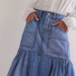Daverri midi denim skirt in medium blue wash with high waist, pockets, tiered hem
