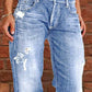 Distressed loose fit light-wash denim jeans with frayed thigh patches