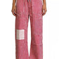 Daverri striped wide-leg pants with red-white stripes and thigh patchwork
