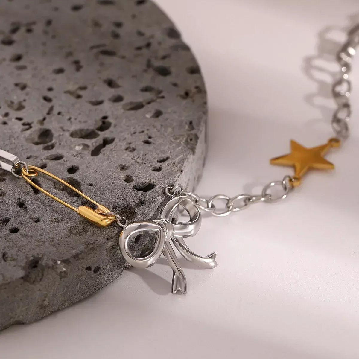 Two-Tone Stainless Steel Bow Star Necklace - DAVERRI FASHIONS