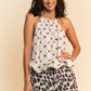 Davi & Dani white halter top with black bow and diamond pattern