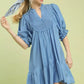 Umgee Smocked Bib Ruffle Hem Babydoll Dress in blue cotton with smocked neckline