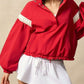 Red cropped bomber jacket with white ruffled sleeve stripes