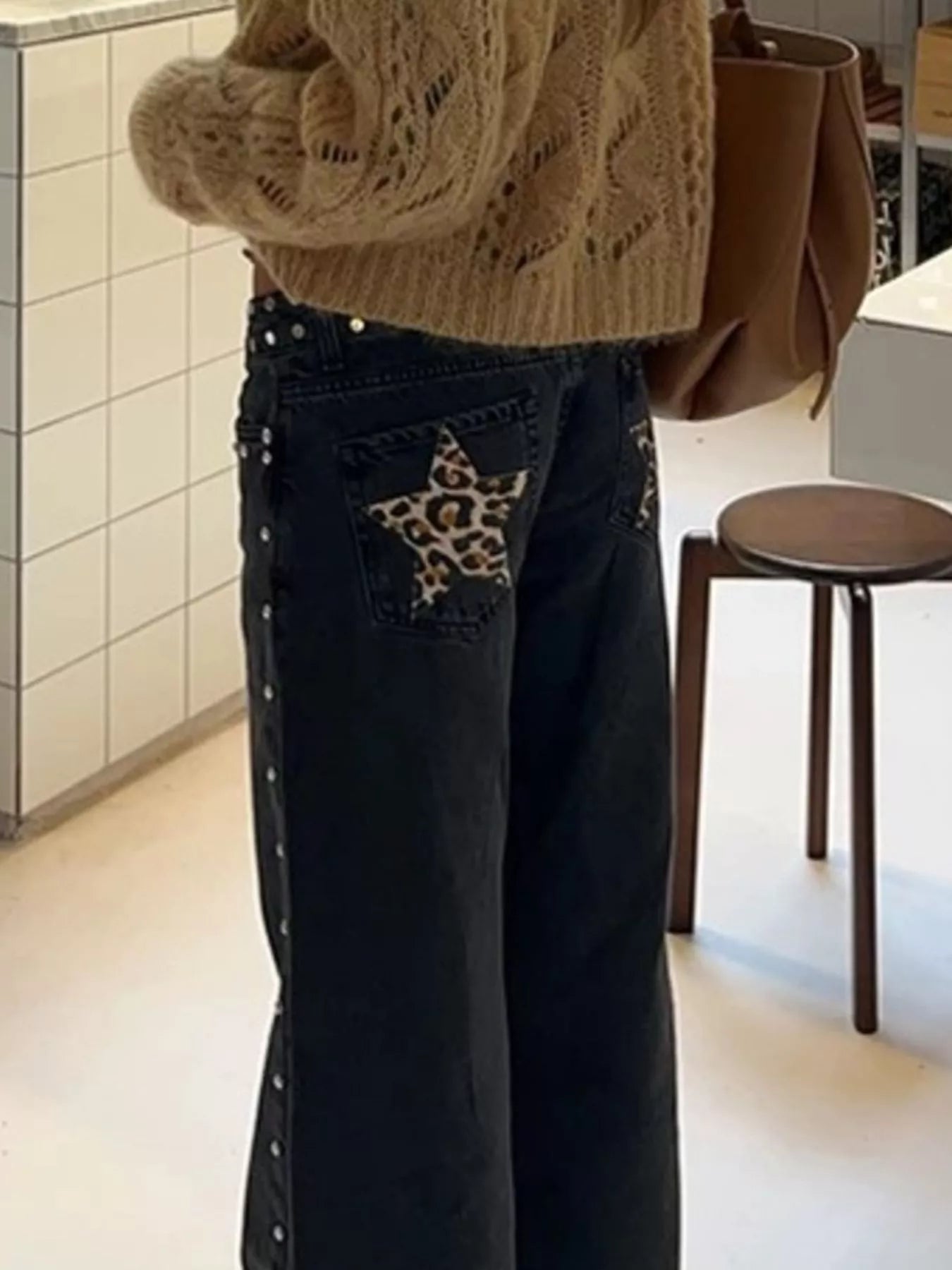 Leopard Star Patches wide leg jeans with dark wash denim, leopard print star patch, and silver studs