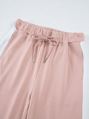 Dusty rose paperbag waist pants in Daverri Fashions set