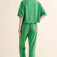 Green quilted pajama set in brushed checkerboard pattern with bandana and sandals