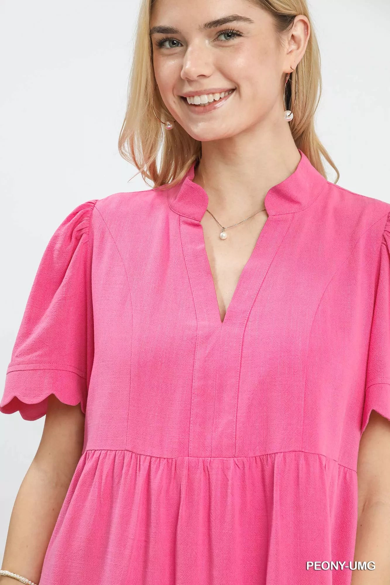 Umgee linen tiered babydoll dress in vibrant pink with scalloped sleeves