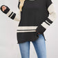 Black and cream color-blocked long-sleeve ribbed knit top with side slits