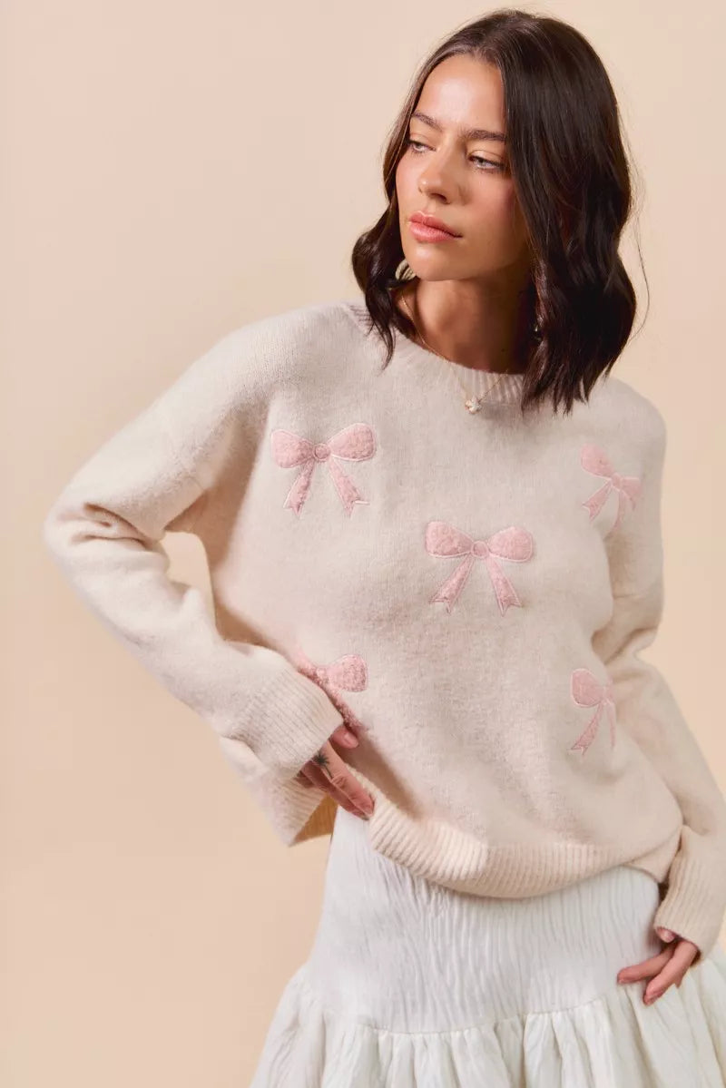 Soft cream knit sweater with pink embroidered bows by SO ME