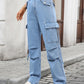 High-waisted light-wash denim cargo jeans with large pockets and straight-leg fit