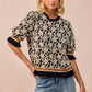 BiBi Textured Rose Knit Top with black cream floral print and ruffled sleeves