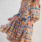 Bohemian floral print long sleeve mini dress in beige with orange, blue, green patterns