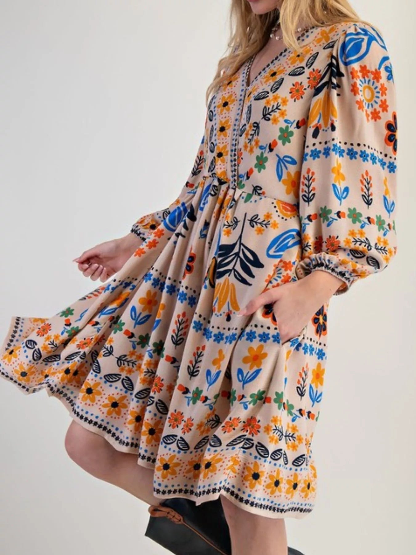 Bohemian floral print long sleeve mini dress in beige with orange, blue, green patterns