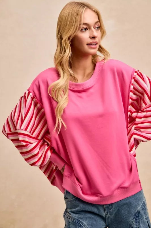 Pink oversized BiBi French terry sweatshirt with ruffled red and white striped sleeves