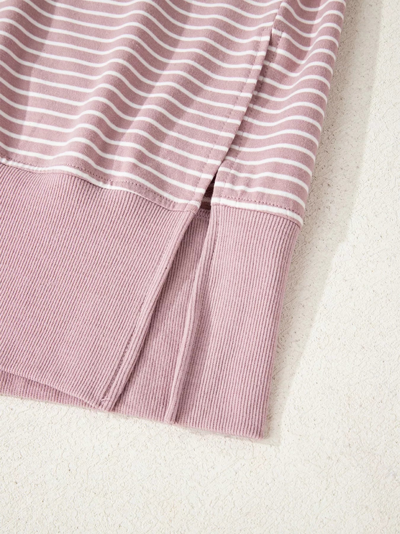 Dusty pink striped thumbhole hoodie with lavender white stripes and ribbed hem