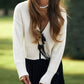 White ribbed knit Tie Front Knit Cardigan with black bow tie detail
