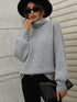 Gray ribbed turtleneck sweater with balloon sleeves