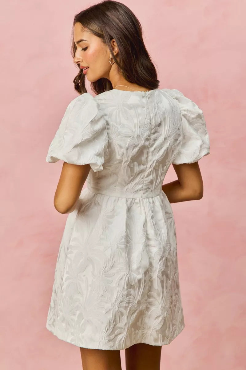 White floral jacquard mini dress with puff sleeves and fitted waist