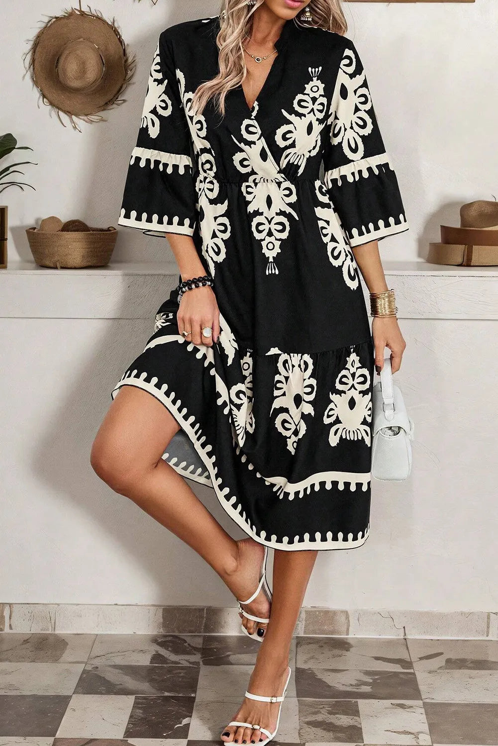Black and white floral print half-sleeve knee-length dress with V-neck and side slits