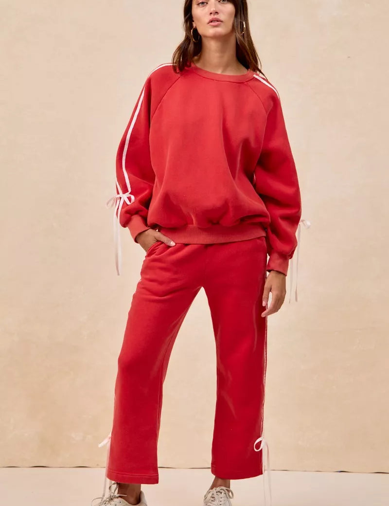 Red BiBi side-lined bow fleece sweatpants set with white sneakers
