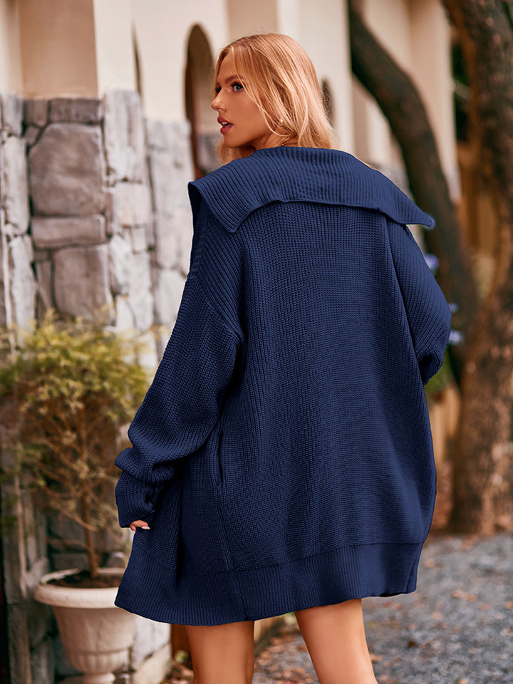 Navy blue oversized knit coat with wide collar and ribbed cuffs