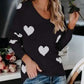 Black long-sleeved Heart Scoop Neck Sweater with white heart patterns
