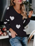 Black long-sleeved Heart Scoop Neck Sweater with white heart patterns