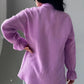 Soft lavender textured cotton blouse with ruffled cuffs and relaxed fit