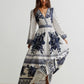 Floral print long sleeve maxi dress with v-neck and asymmetrical hem