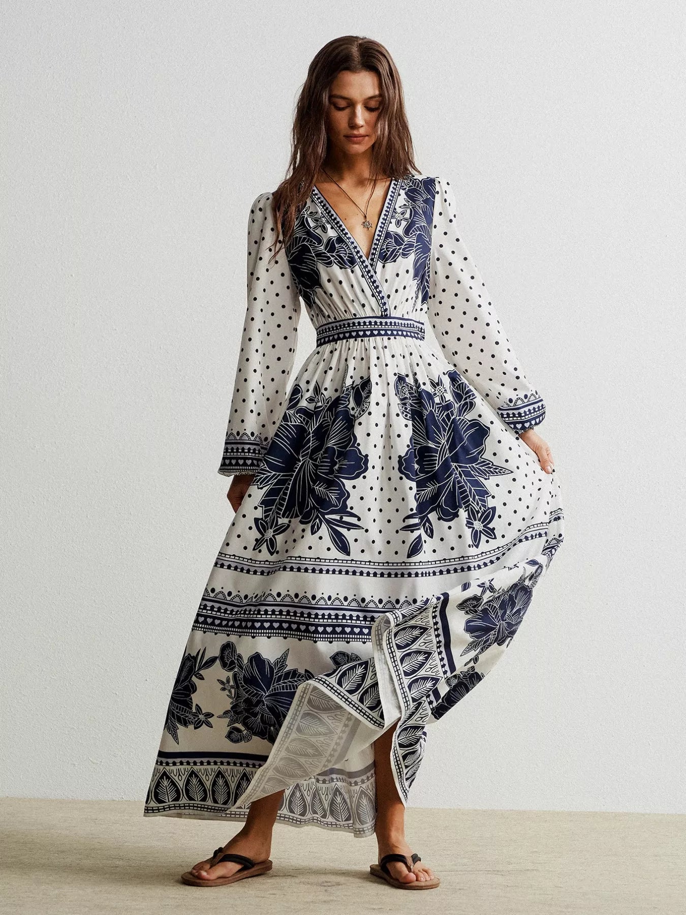 Floral print long sleeve maxi dress with v-neck and asymmetrical hem