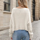 Cream-colored chunky-knit round neck dropped shoulder sweater