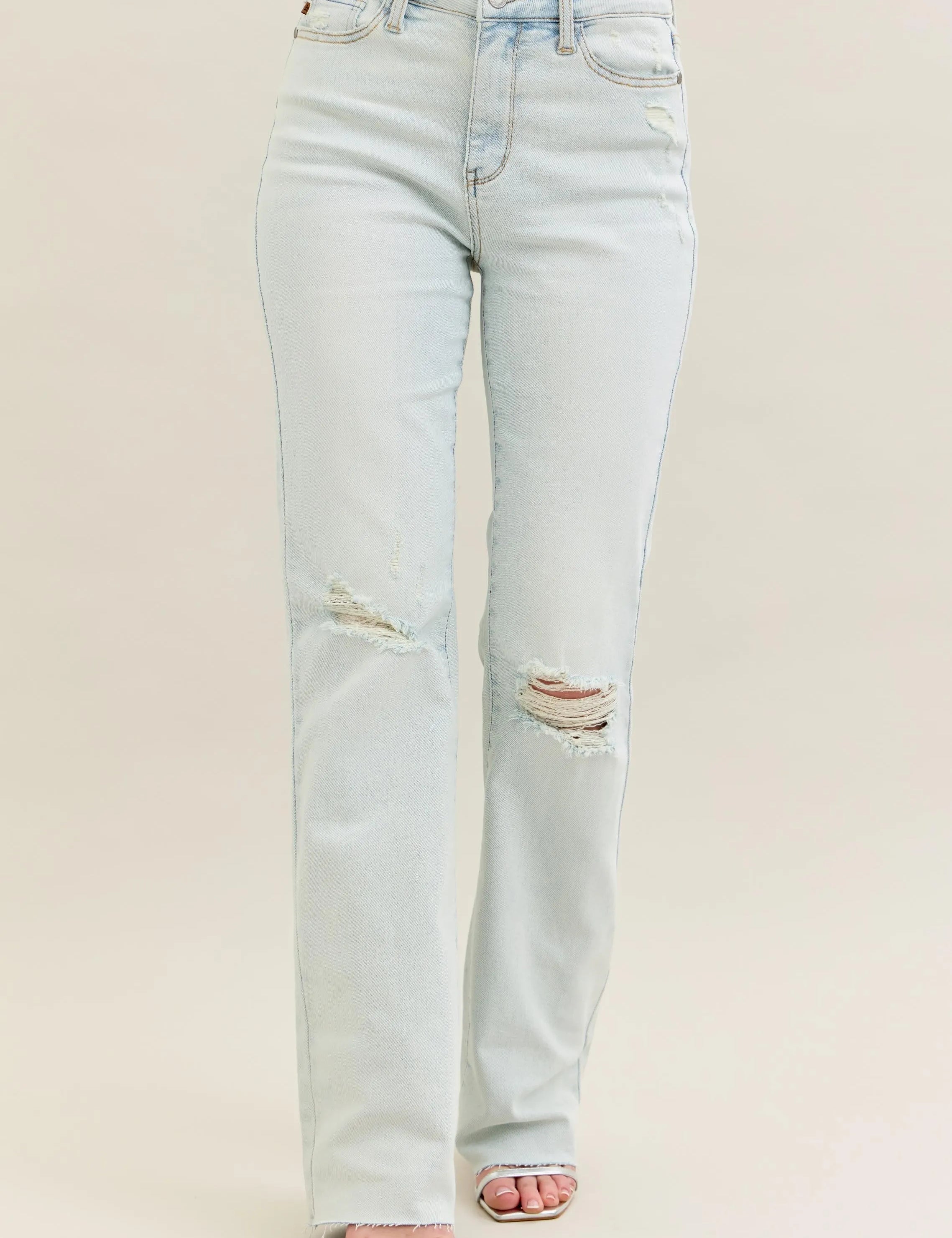 Light blue distressed Judy Blue bootcut jeans with high waist and fray hem