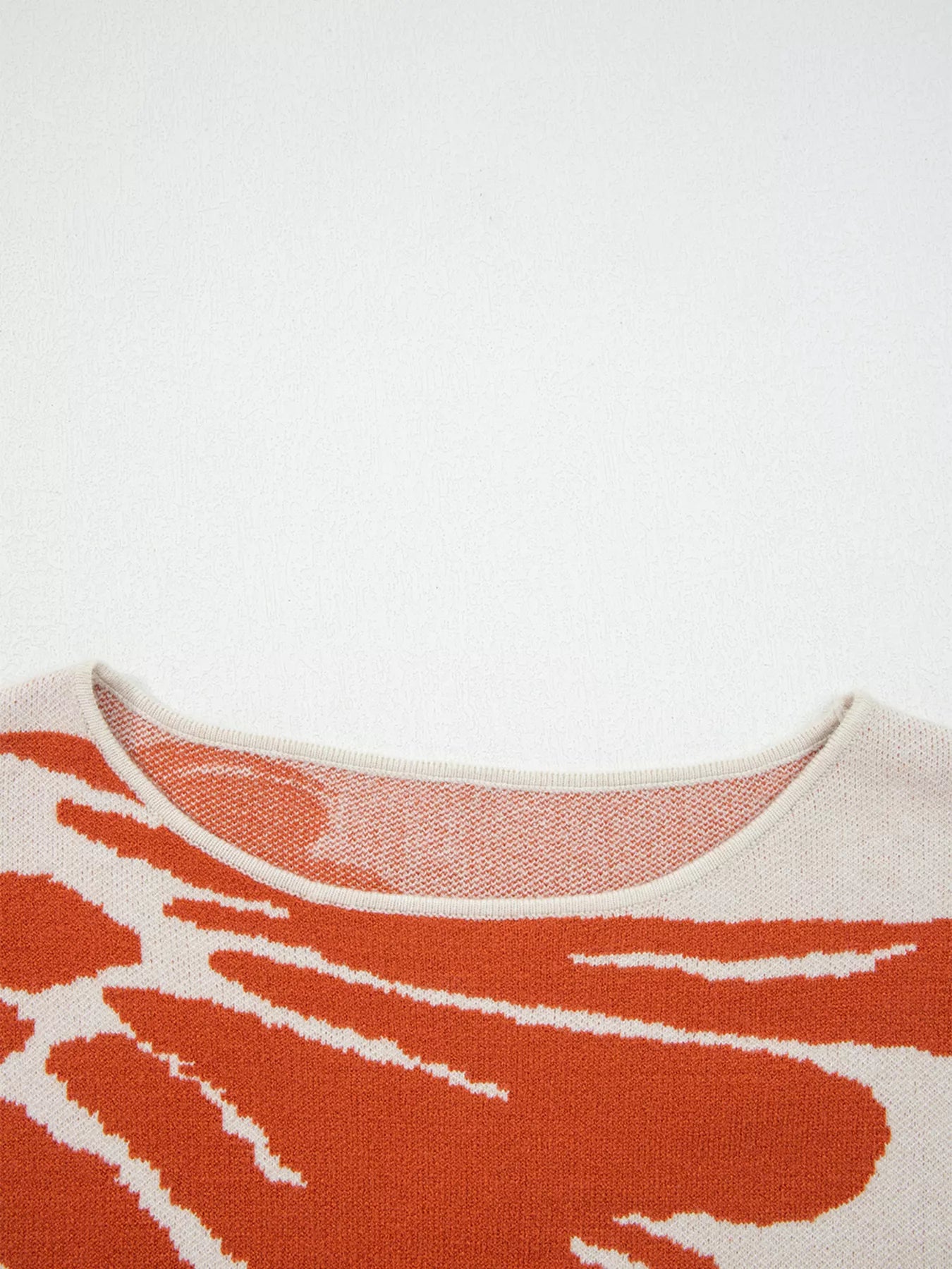 Boho flower pattern oversized knit sweater in orange white abstract design
