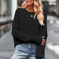 Black round neck drop shoulder long sleeve cropped sweater with ribbed cuffs