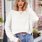 White ribbed knit cropped sweater with dropped shoulders