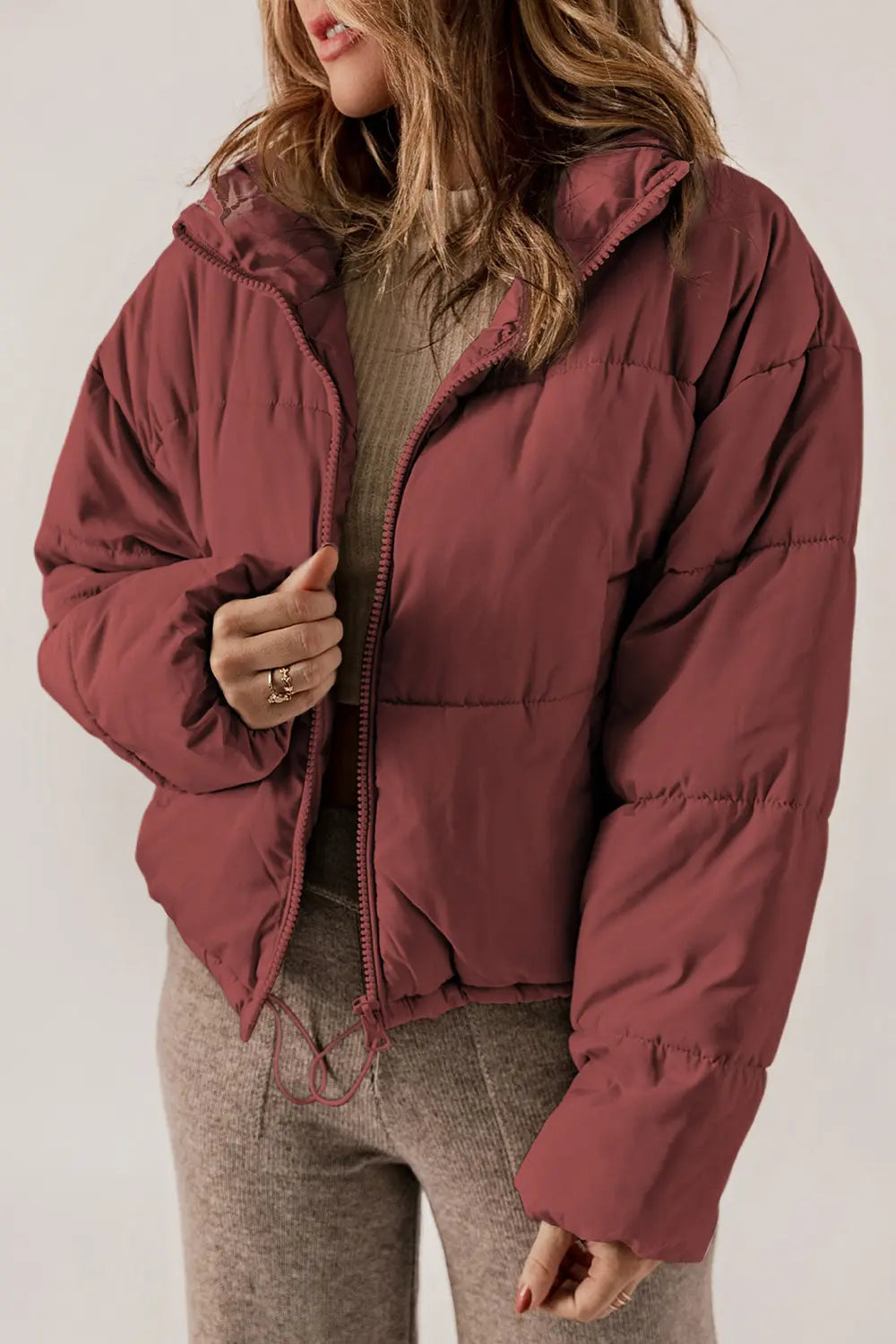 Maroon zip-up puffer jacket with hood and collar for winter warmth