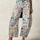 Printed wide leg jeans in white denim with colorful graffiti print