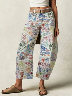 Printed wide leg jeans in white denim with colorful graffiti print