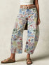 Printed wide leg jeans in white denim with colorful graffiti print