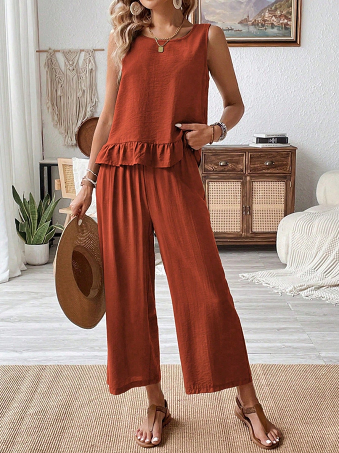 Rust-colored sleeveless Daverri ruffle hem tank top with ruffled hemline