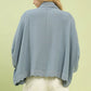 Light blue pinstriped Umgee oversized button-down shirt with flowing silhouette and scalloped hem