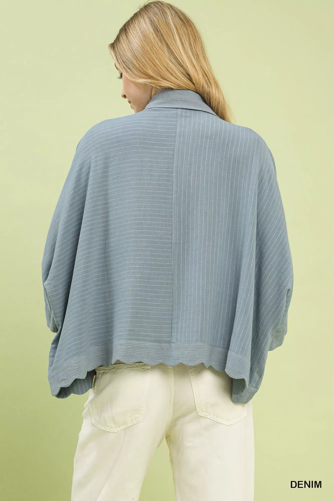 Light blue pinstriped Umgee oversized button-down shirt with flowing silhouette and scalloped hem