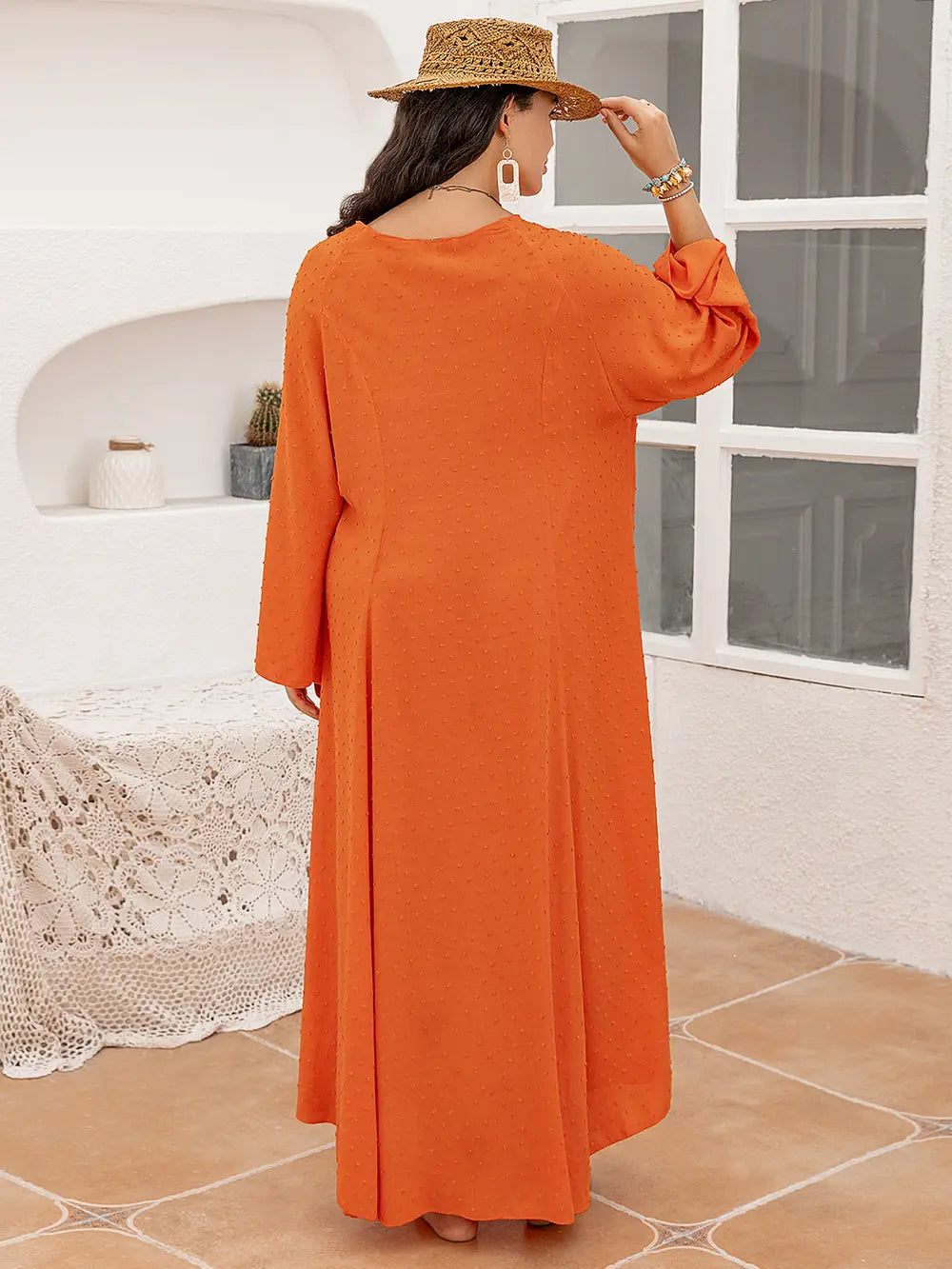 Plus size tie neck long sleeve slit dress in flowing orange maxi style