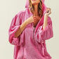 Vibrant pink BiBi waffle-knit half zip corduroy hoodie with oversized fit and puffed sleeves