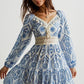 Bohemian print midi dress in blue white floral geometric pattern with tassel detail