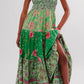 Floral tiered maxi dress in green with pink beige blossoms, smocked bodice, bows, ruffles, slit