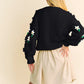Black knit Davi & Dani floral cardigan with embroidered flowers on sleeves