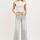 Risen Tummy Control Mid Rise Crop Wide Pintuck Jeans in light-wash denim