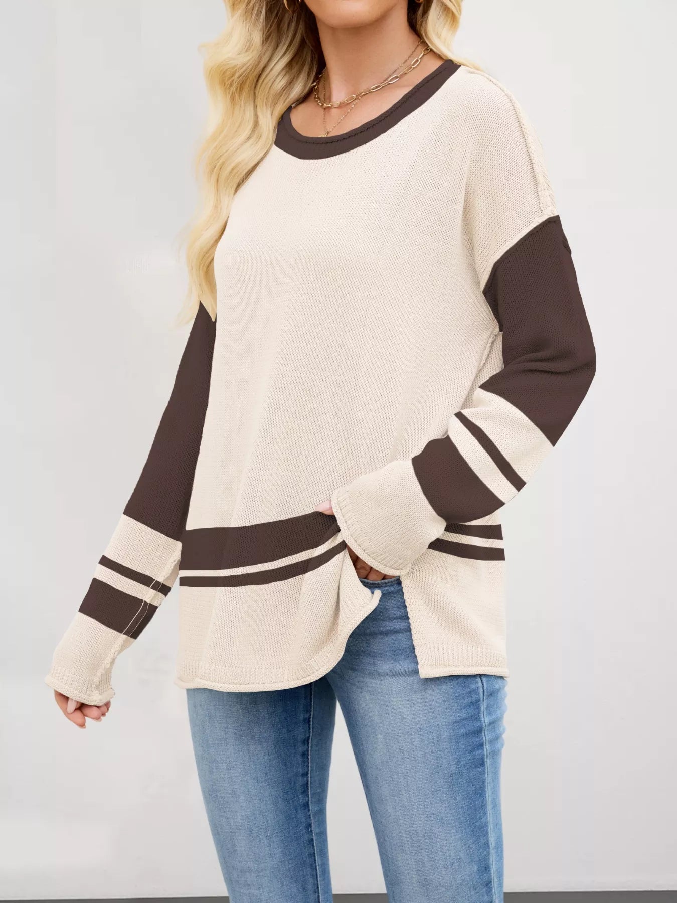 Color block side slit sweater in cream with brown sleeves and stripes