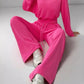 Bright pink velour boat neck long sleeve top and drawstring pants set
